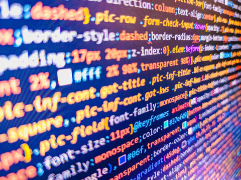 Screen of colored lighted syntax of source code script with defocus. Finance data concept. Abstract technology background. Programming code abstract screen of software developer - Powered by Adobe