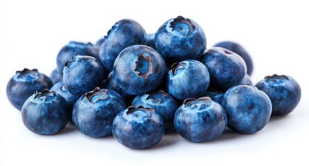 Fresh and Juicy Blueberries Piled Together on White Background for Culinary and Health Imagery