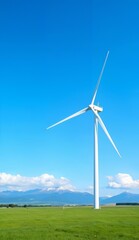 Fototapeta premium Wind Turbine Generating Energy in a Lush Green Field Under a Clear Blue Sky