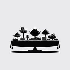 Elegant buffet table setting with covered dishes and desserts