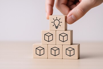 Creative Idea Conceptualization Displayed on Wooden Blocks Arranged in Pyramid Formation, Symbolizing Innovation and Solutions