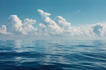 Obraz premium Calm Ocean Waters Reflecting a Bright Blue Sky with Puffy White Clouds on a Sunny Day