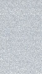 Close-up of a textured, slightly grainy, light grey surface