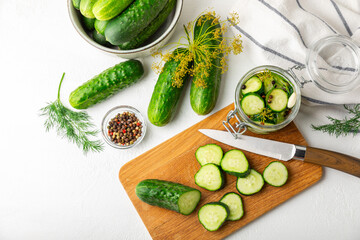 Freshly-salted homemade cucumbers in a jar on a wooden background. pickled cucumbers with dill,garlic and pepper.canned cucumbers.cucumbers and dill.Recipe of homemade preservations.fermented veggies.