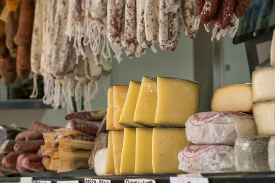 Food stall with dairy and meat products at Majorca farmers market Spain