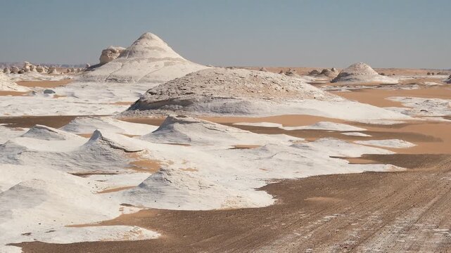 White rock formations and sand dunes in Egypt's White Desert, natural desert landscape	