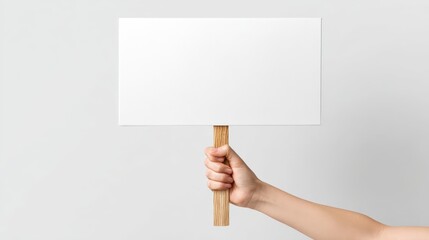 Fototapeta premium Hand Holding Blank Sign Mockup for Protest, Advertisement or Presentation on White Background