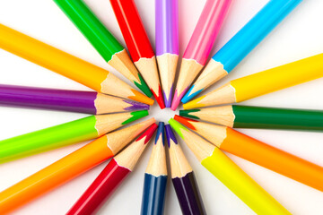Colored pencils on a bright colored background. Equipment for coloring. Stationery for creativity.Back to school. Flatlay. Children's Creativity and Education. Rainbow.Space for text. Copy space.