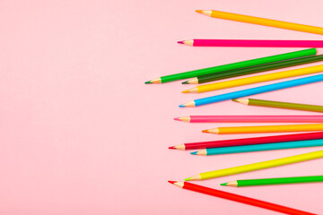 Colored pencils on a bright colored background. Equipment for coloring. Stationery for creativity.Back to school. Flatlay. Children's Creativity and Education. Rainbow.Space for text. Copy space.