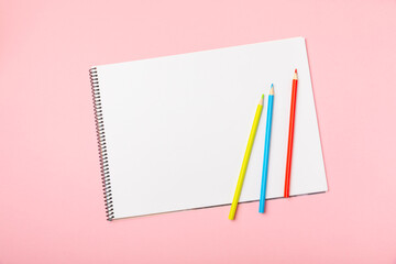 Colored pencils on a bright colored background. Equipment for coloring. Stationery for creativity.Back to school. Flatlay. Children's Creativity and Education. Rainbow.Space for text. Copy space.