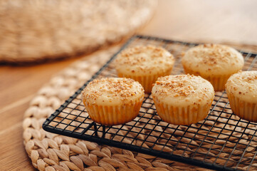 Homemade muffins cooling on a wire rack after baking