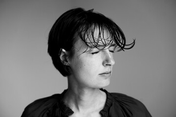 Dramatic black and white profile portrait showcasing classical silhouette with natural hair texture and professional studio lighting technique