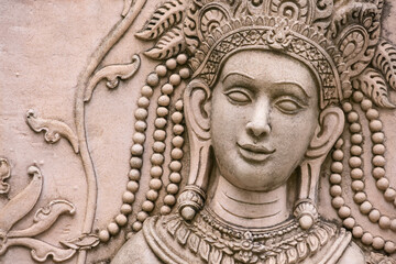 Intricate stone carving of an Apsara dancer in Angkor Wat, Cambodia, capturing traditional Khmer art and culture
