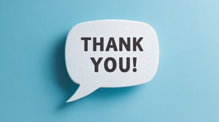Gratitude Expression: "Thank You" Message in Speech Bubble on Blue Background, conveying appreciation and positive sentiment