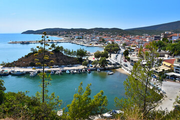 Naklejka premium Limenaria village on the island of Thasos in Greece stock photo images. View of the resort of Limenaria, Greece photo. Thassos Greek island landscape with harbour stock photo