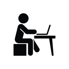Person sitting at desk working on a laptop computer