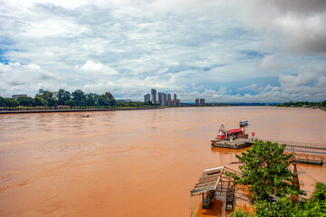 Fototapeta premium View of the Mekong River as it passes through the Golden Triangle, with the city of Van Pak Len in Laos in the background