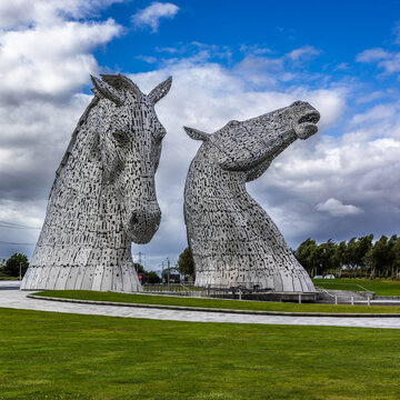 The Kelpies are the world's largest equine sculptures, standing at 30 meters tall and weighing over 300 tonnes each. They are located at The Helix near Falkirk in Scotland. Shot 5 July 2025.