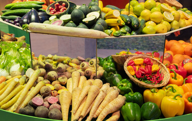 Colorful assortment of fresh vegetables displayed in a market with vibrant textures and shapes