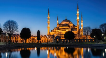 Naklejka premium Golden Splendor of Istanbul's Blue Mosque Reflected in a Tranquil Pool at Twilight.