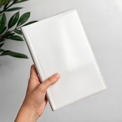 Woman Hand Holding White Notebook Mockup