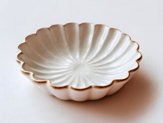 Small ceramic jewelry dish with scalloped edges