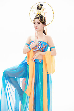 Chinese girls dressed in Tang Dynasty Dunhuang costumes dancing the flying apsaras dance