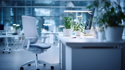 Fototapeta premium Modern Office Space Featuring Ergonomic Chair, Desktop Computer, and Green Plants for a Healthy Workplace