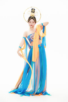 Chinese girls dressed in Tang Dynasty Dunhuang costumes dancing the flying apsaras dance