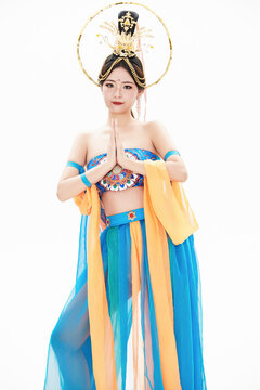 Chinese girls dressed in Tang Dynasty Dunhuang costumes dancing the flying apsaras dance