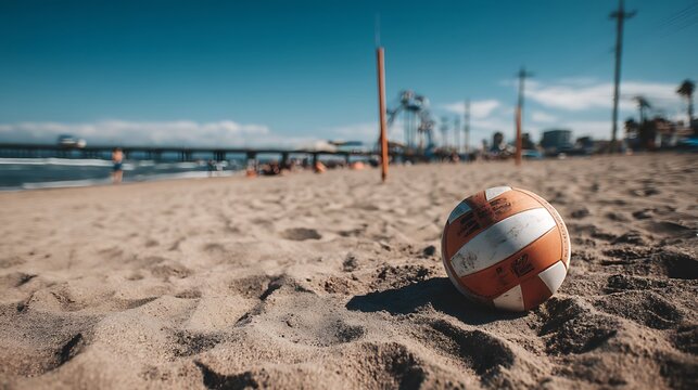 Sandy volleyball on beach ready for a sunny and active game day with friends .