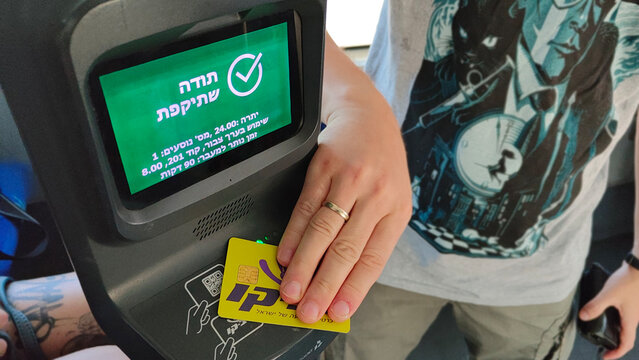 Rishon Lezion, Israel &ndash; 11.08.2025. Rav-Kav card being tapped on a bus validator in Israel, concept of public transport payment, fare validation, and smart transit system.