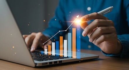Man using laptop with a rising graph overlay, illustrating business growth and financial success.