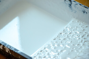 Photo of painting with white paint on wood. Interior painting. Making repairs, painting. White paint © Елена Загорий