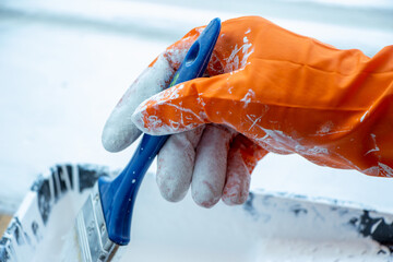 Photo of painting with white paint on wood. Interior painting. Making repairs, painting. White paint © Елена Загорий