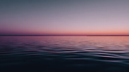 Fototapeta premium Calm water reflecting a vibrant sunset.