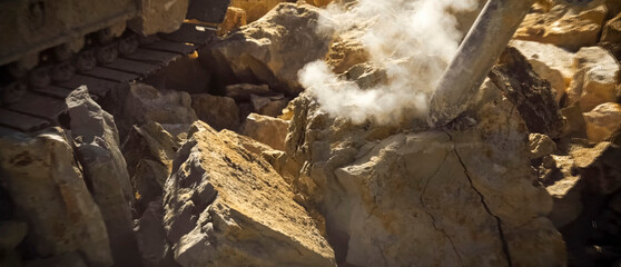 Panorama, the work of hydraulic hammer on the rock in the quarry