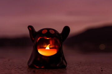 Concept: Halloween beach and ocean background with sea ghost with witch ghost fire, dark, scary tone.