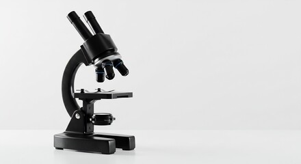A Modern Black Microscope Isolated on a White Background for Science and Research