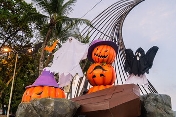 Concept: Halloween beach and ocean background with spider, witch and ghost pumpkin. Dark, scary tone.