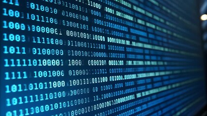 Blue binary code flows down a computer screen, representing a digital technology concept of data and communication - Powered by Adobe