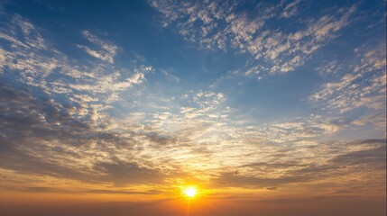 Fototapeta premium Blue and Orange Cloudy Sky Background with Golden Sunset Light – Hues of Azure and Amber Blending in Clouds, Bathed in Warm Golden Rays of the Setting Sun
