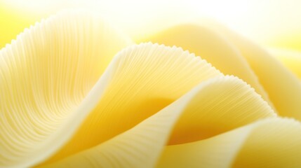 Abstract waves in soft yellow fabric with delicate textured patterns create a soothing visual