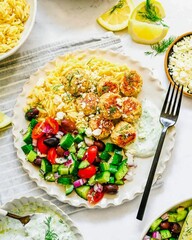 Greek Chicken Meatballs with Orzo, Salad, and Tzatziki Sauce