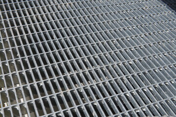 New Galvanized Steel Pathway Mesh. Durable metal mesh with a rough texture. Industrial steel construction provides durability and drainage.