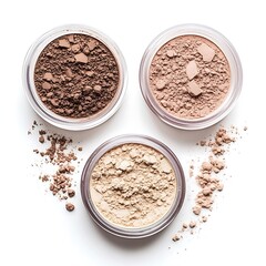 Three Jars of Loose Powder Foundation in Different Shades on White Background