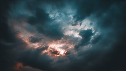 Obraz premium Blue and Orange Cloudy Sky Background with Golden Sunset Light – Hues of Azure and Amber Blending in Clouds, Bathed in Warm Golden Rays of the Setting Sun