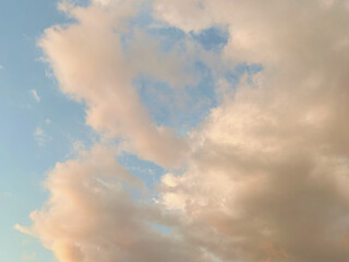 afternoon skies with soft light blue sky and broken white clouds