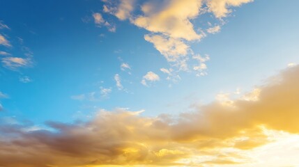 Obraz premium Blue and Orange Cloudy Sky Background with Golden Sunset Light – Hues of Azure and Amber Blending in Clouds, Bathed in Warm Golden Rays of the Setting Sun