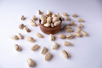 salted pistachios on a white background